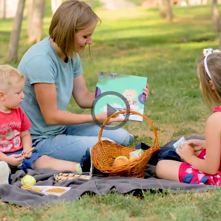 A parent and child reading a Fairy Dalia book together